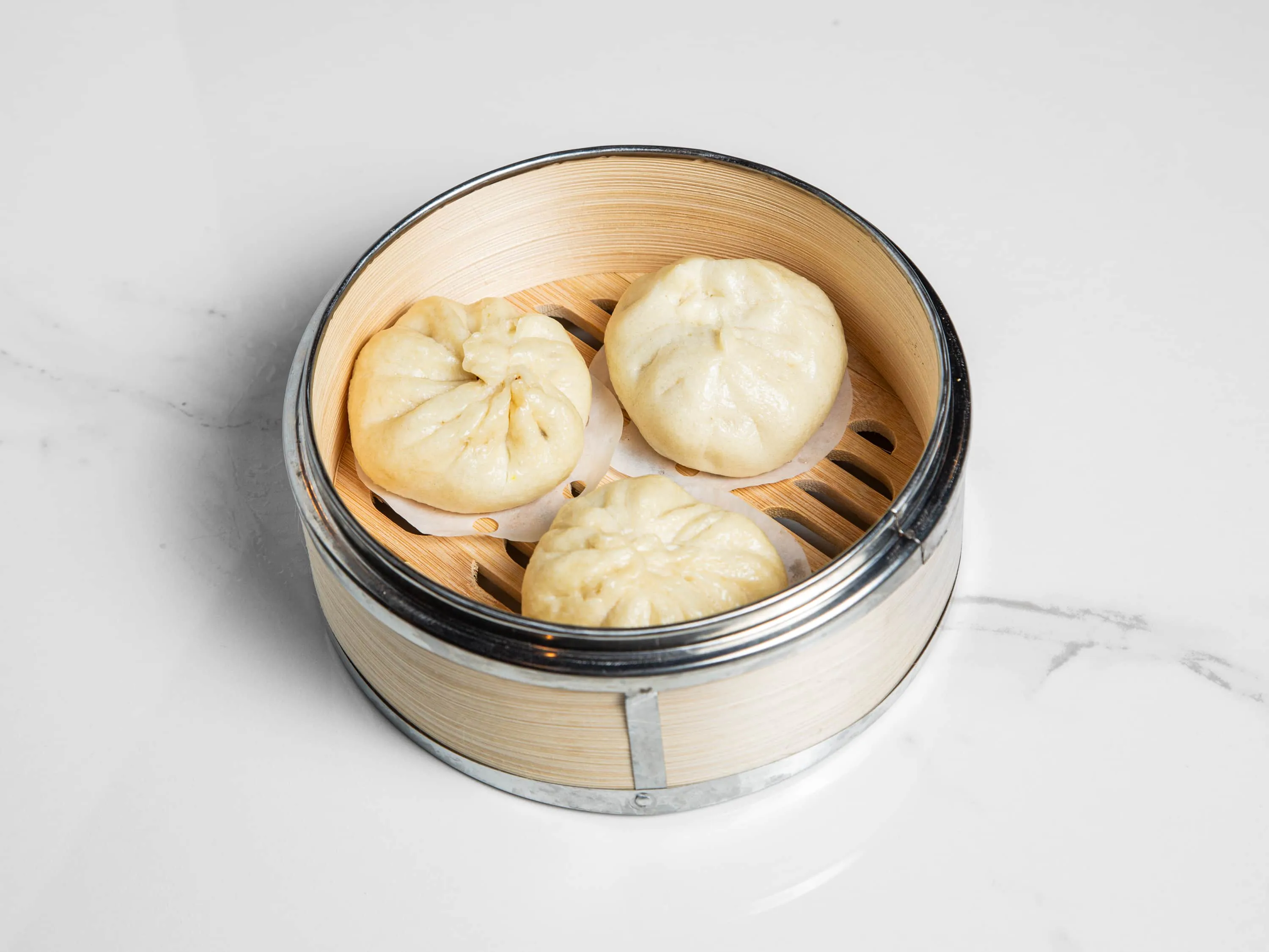 Steamed bun with savory pork filling at Kuchi, a Buffet Restaurant in Tampa