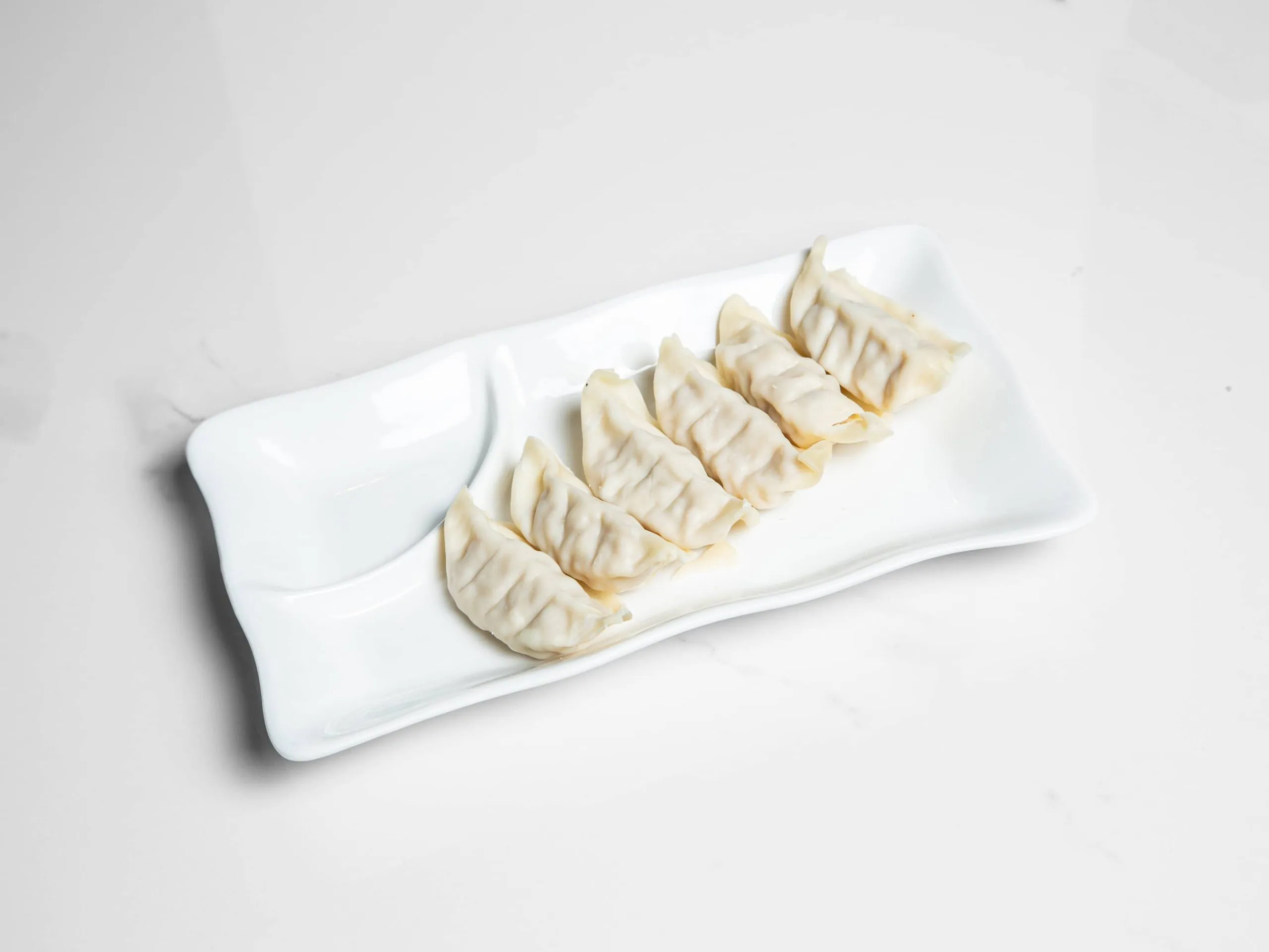 Steamed pork dumplings with savory filling at Kuchi, a Buffet Restaurant in Tampa